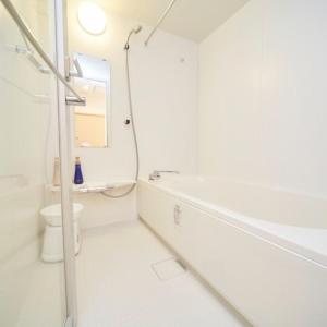 a white bathroom with a sink and a toilet at Sakura Garden Hotel - Vacation STAY 79004 in Osaka