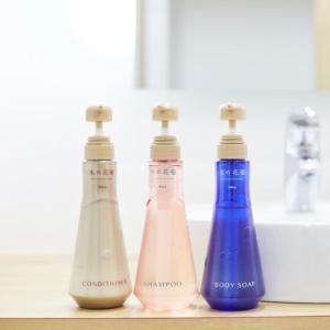 three different colored bottles sitting on a counter at Sakura Garden Hotel - Vacation STAY 79004 in Osaka