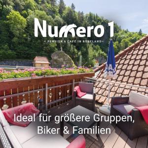 a magazine cover of a balcony with a roof at Numero1-Pension und Cafe in Rübeland
