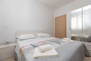 Postel nebo postele na pokoji v ubytování Apartmani Perak