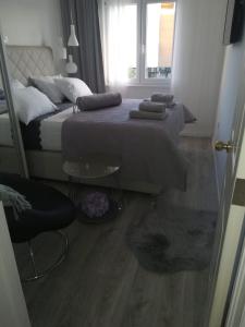 Postel nebo postele na pokoji v ubytování Apartmani Vidoš