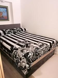 Postel nebo postele na pokoji v ubytování Roberto Apartment