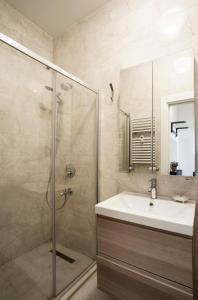 a bathroom with a sink and a shower at Deniz Suites in Istanbul