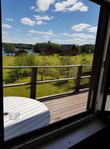 a view of a porch with a view of a field at Nijolės sodyba in Aukštadvaris