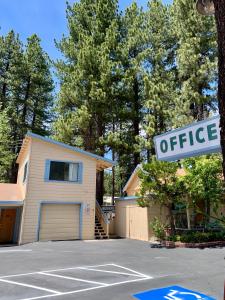 a house with a office sign in front of a garage at Stevenson’s Inn in Kings Beach