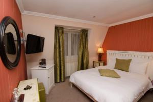 Llit o llits en una habitació de Hotel Boutique Monaco