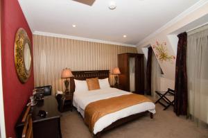 Ένα ή περισσότερα κρεβάτια σε δωμάτιο στο Hotel Boutique Monaco