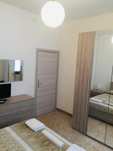 Postel nebo postele na pokoji v ubytování B&B dell'Amicizia