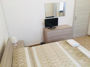 Postel nebo postele na pokoji v ubytování B&B dell'Amicizia