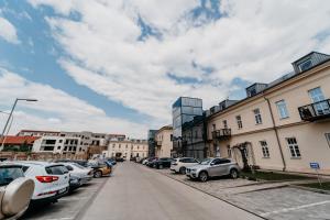 a street with cars parked on the side of the road at AH Luxury Baštová 10 in Košice