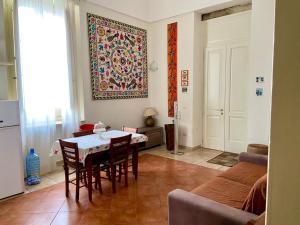 a living room with a table and a couch at Il Torrino in Galatina