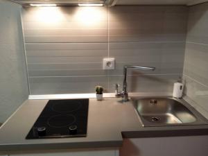 a kitchen counter with a sink and a sink at Berulia accommodation in Brela +86 photos
