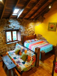 a living room with two beds and a couch at Apartamento en Plena Naturaleza in La Cavada