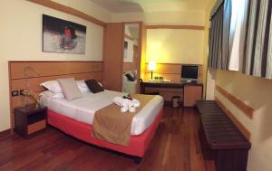 Postel nebo postele na pokoji v ubytování Best Western Hotel Dei Cavalieri