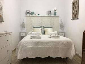 Posteľ alebo postele v izbe v ubytovaní Casa del Mercado