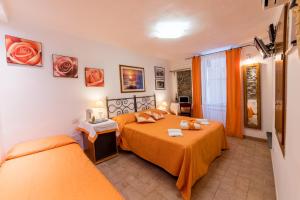 Tempat tidur dalam kamar di Via Del Santo - FrancamariaDotCom