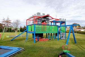 a playground with a play equipment in a park at Alpine View Motel in Te Anau