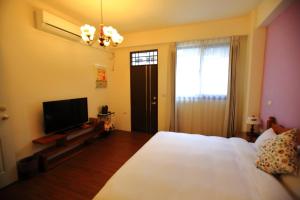 TV o dispositivi per l'intrattenimento presso 影拾光民宿Shadow of Light B&B