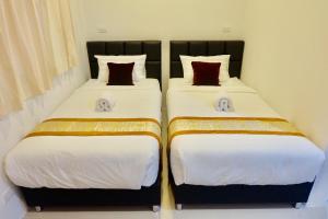 Postel nebo postele na pokoji v ubytování Vamin Resort Chiangkhan Loei วามินทร์รีสอร์ท เชียงคาน เลย