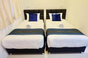 Postel nebo postele na pokoji v ubytování Vamin Resort Chiangkhan Loei วามินทร์รีสอร์ท เชียงคาน เลย