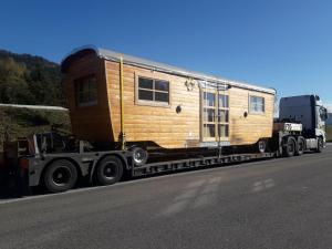a semi truck with a tiny house on the back at Tiny House Steirerbua in Birkfeld