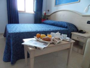 Postel nebo postele na pokoji v ubytování Hotel Belvedere