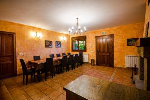 a dining room with a long table and chairs at Casa Almoravid in Daroca de Rioja