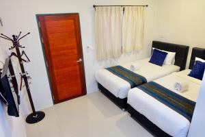 Postel nebo postele na pokoji v ubytování Vamin Resort Chiangkhan Loei วามินทร์รีสอร์ท เชียงคาน เลย