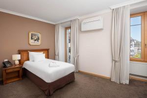 Letto o letti in una camera di Hotel Le Rive