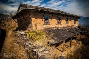 an old building on the side of a mountain at Tiger Mountain Pokhara Lodge in Pokhara