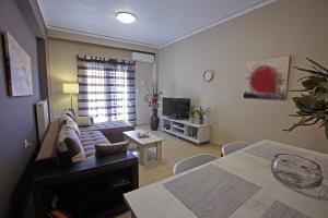 Televízia a/alebo spoločenská miestnosť v ubytovaní C.L.A. City Loux Apartment