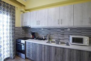 Kuchyňa alebo kuchynka v ubytovaní C.L.A. City Loux Apartment