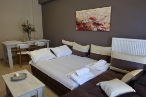 Posteľ alebo postele v izbe v ubytovaní C.L.A. City Loux Apartment