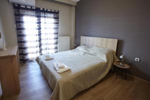 Posteľ alebo postele v izbe v ubytovaní C.L.A. City Loux Apartment