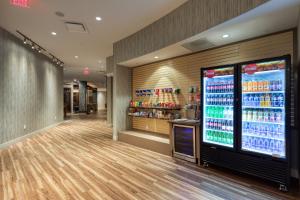 a store with a large vending machine with drinks at Holiday Inn Express & Suites - Charlotte - South End, an IHG Hotel in Charlotte