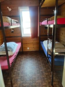 Postel nebo postele na pokoji v ubytování Målselvfossen Feriesenter