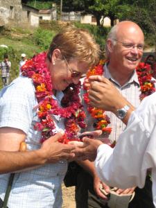 
a man and a woman cutting a red ribbon at Tiger Mountain Pokhara Lodge in Pokhara
