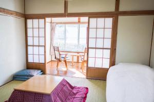 Postel nebo postele na pokoji v ubytování Ryokan Fuji Heights