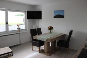 TV a/nebo společenská místnost v ubytování Ferienwohnung Zum Wildpark