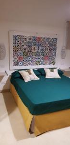 a bedroom with a large bed in a room at Tenuta La Milogna in Gallipoli