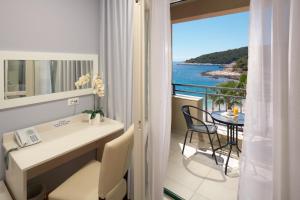 a hotel room with a view of the ocean at Hotel Fortuna in Hvar