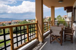 a balcony with a table and chairs and a view at Sea View Apartment Grek Nea 3 in Nea Roda