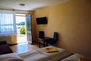 Posteľ alebo postele v izbe v ubytovaní Hotel Gołuń