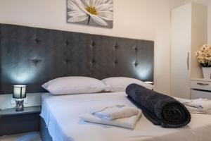 Postel nebo postele na pokoji v ubytování Luxury rooms Zadar old town