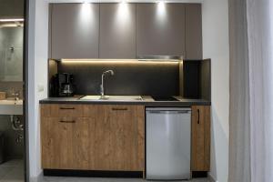 a kitchen with a sink and a dishwasher at Sea View Apartment Grek Nea 3 in Nea Roda