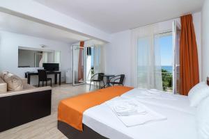 Postel nebo postele na pokoji v ubytování Hotel Cosmos