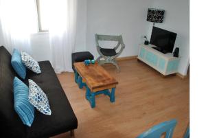 TV a/nebo společenská místnost v ubytování Lindo y acogedor Apartamento Grao Playa Gandia piso 5to sin ascensor