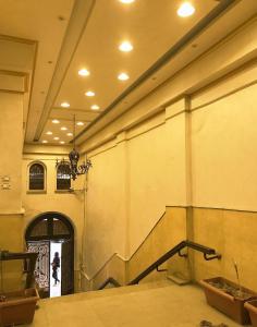 a hallway with a staircase in a building at Emerald Hotel in Cairo