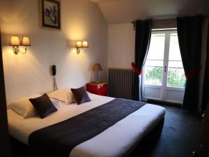 Postelja oz. postelje v sobi nastanitve Hostellerie du Val d'Or