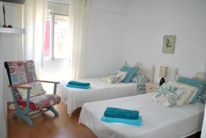 Postel nebo postele na pokoji v ubytování Lindo y acogedor Apartamento Grao Playa Gandia piso 5to sin ascensor